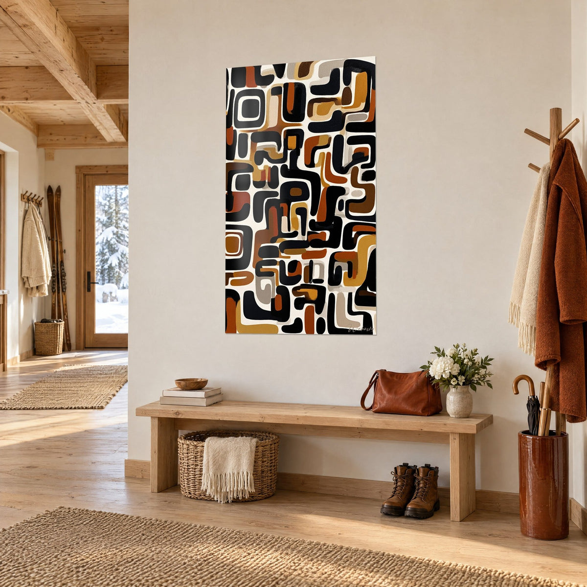 Wall art with abstract African motifs in black and rust on a cream background, wooden bench and coat, chalet entrance