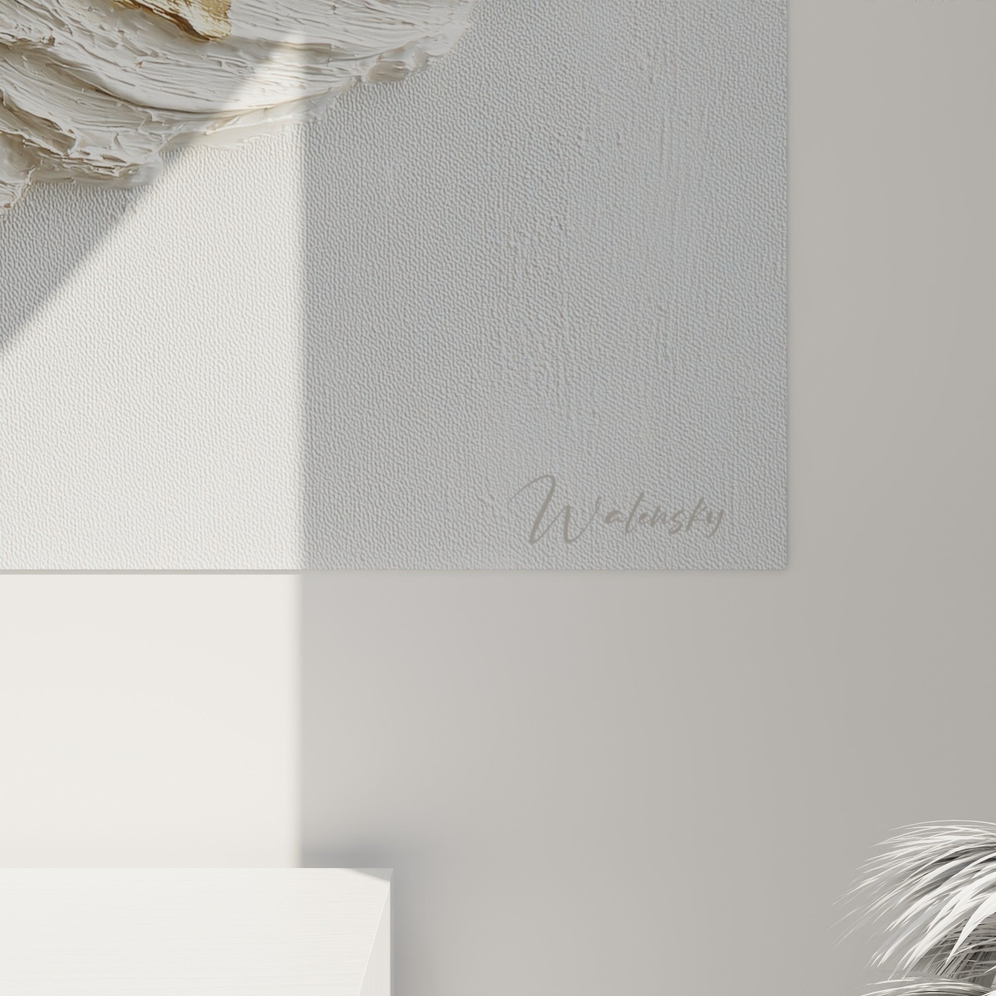 Overview of embossed feather canvas with gold and white relief on light wall, contemporary wall art
