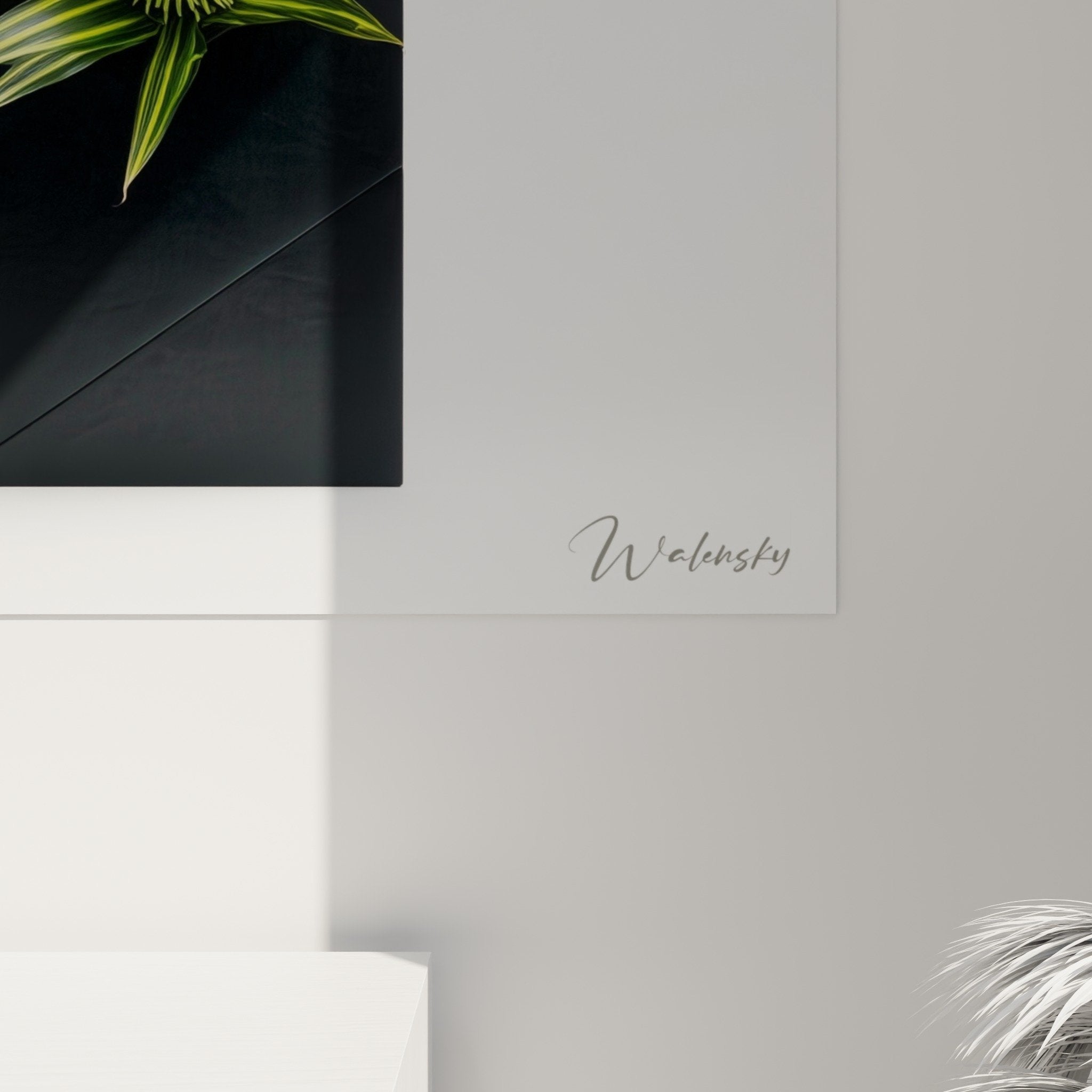 Overall view of the ikebana artwork showing the balance between white flowers, green bamboo and geometric black vase