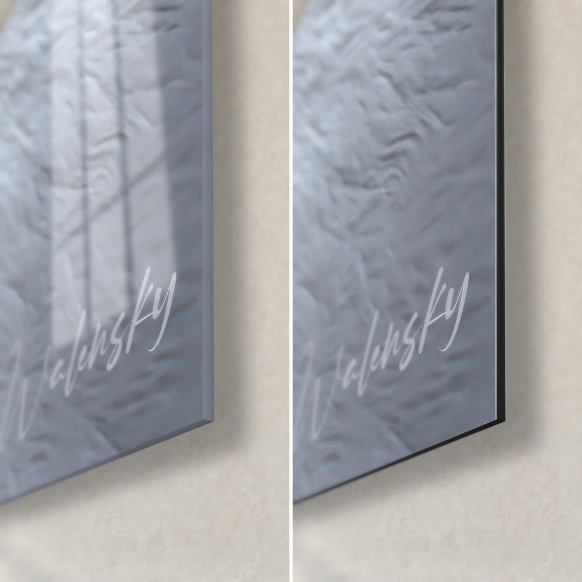 Wall art white puppy lying down, bottom right corner: glossy silver acrylic glass on the left, matte black Dibond aluminium on the right, 3 mm edge
