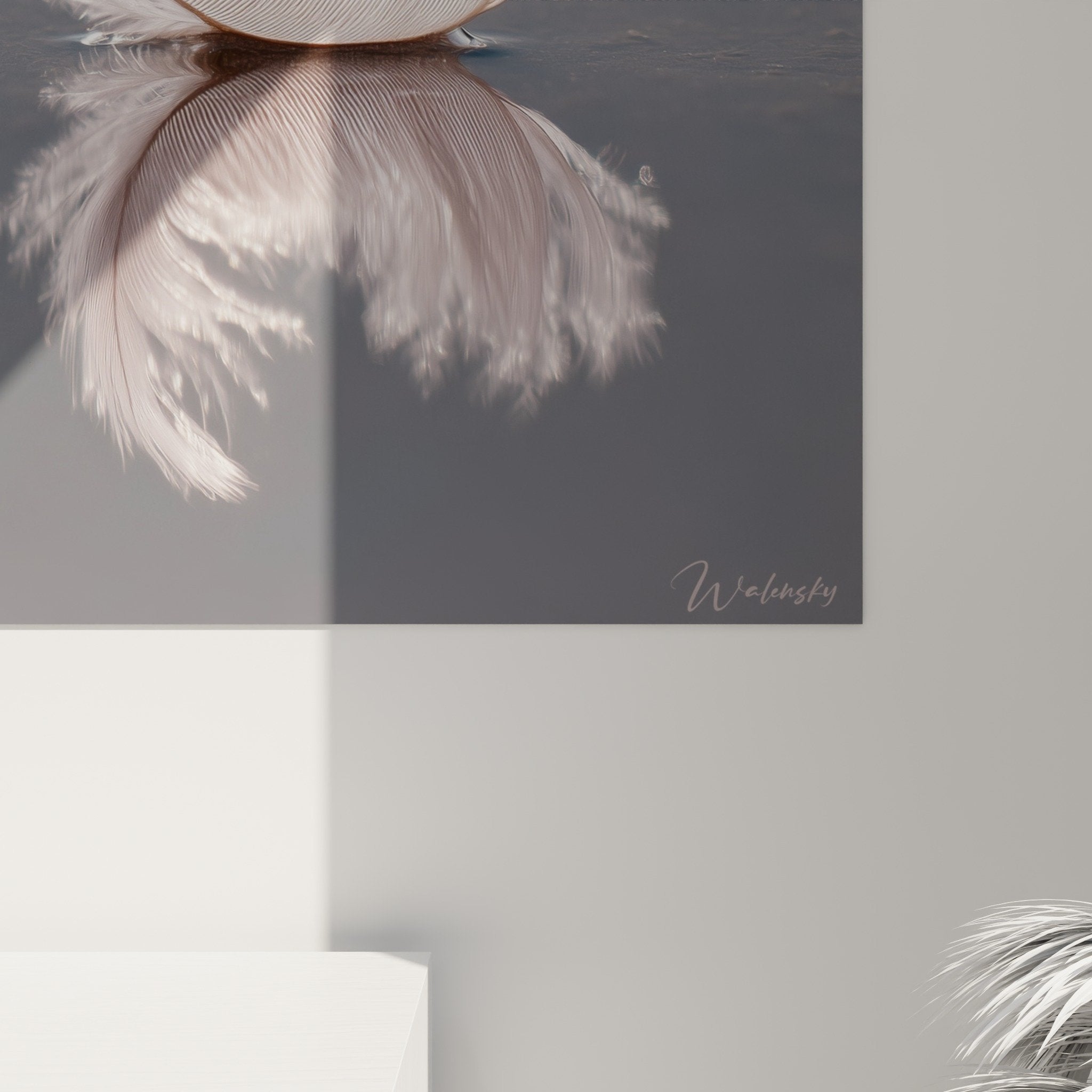 Overview of minimalist feather artwork in a sleek contemporary interior setting
