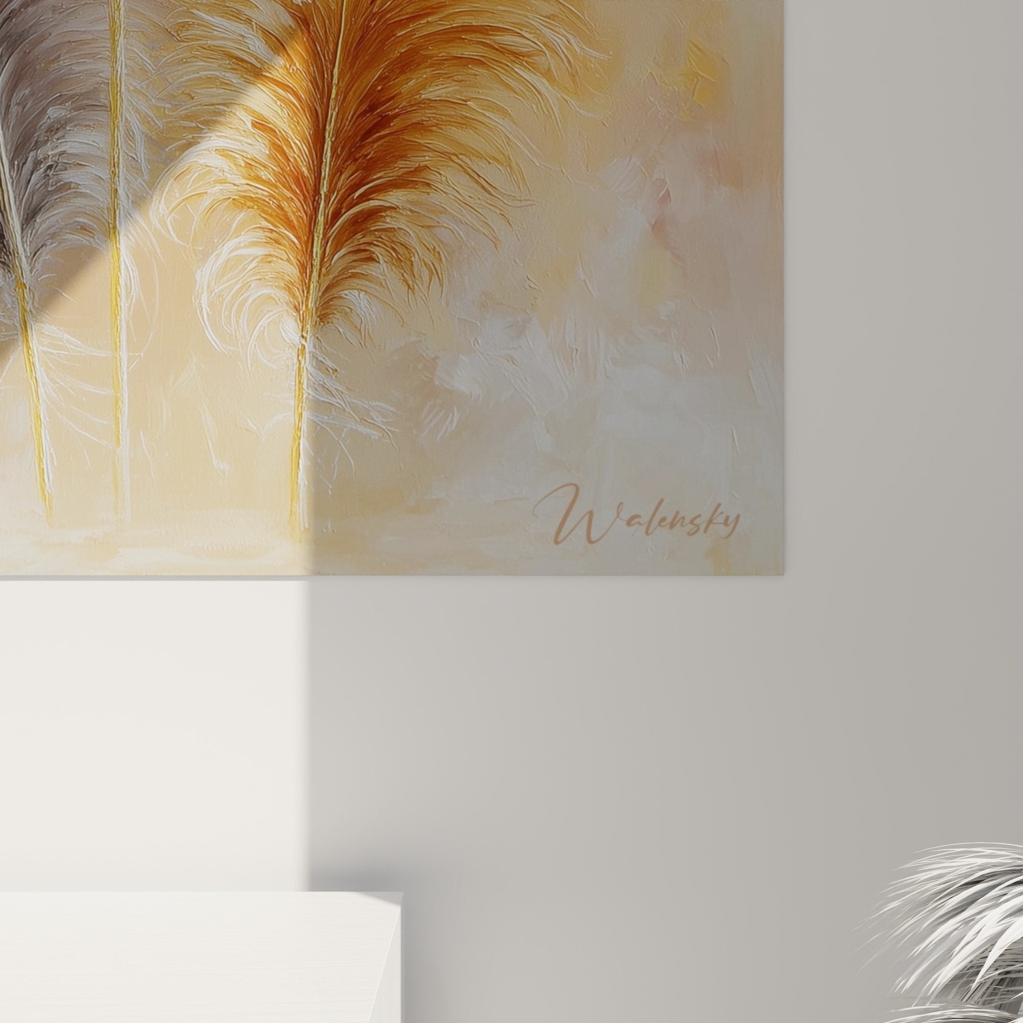 Distant view of three white and gold feathers artwork in modern interior living room wall decor