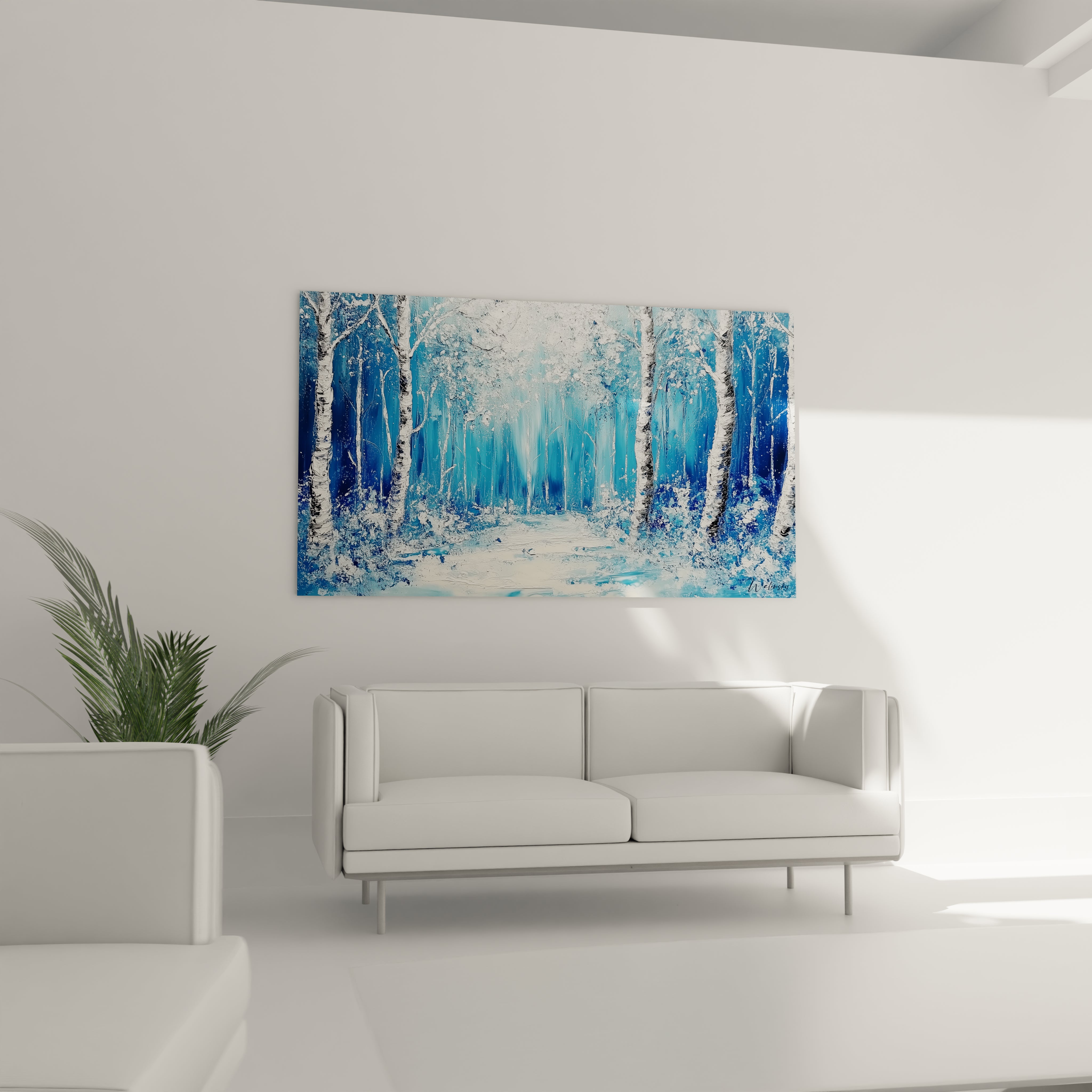 Tableau forêt Walensky avec peinture bleue et blanche accroché au-dessus d'un canapé moderne blanc