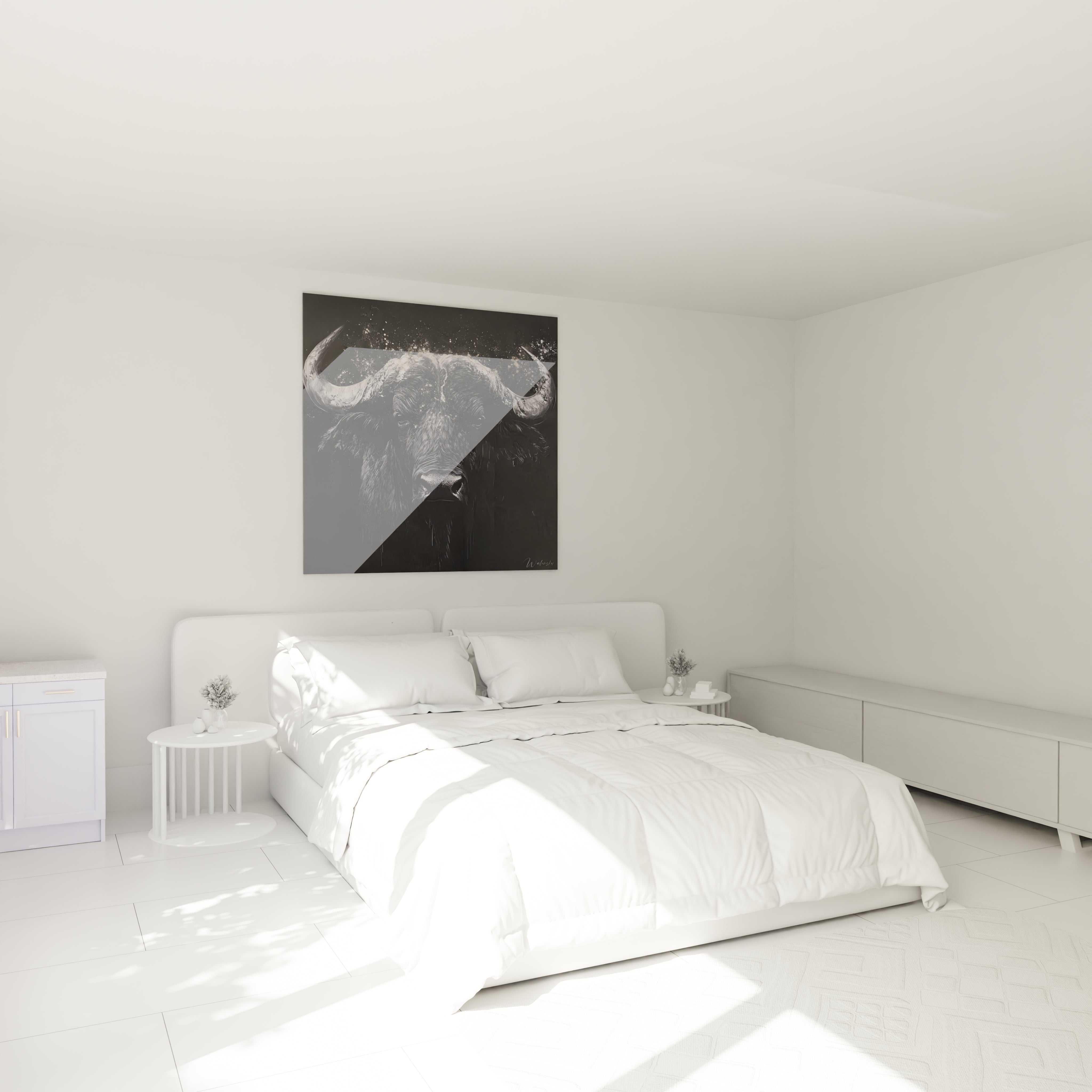 Tableau buffle Walensky noir blanc accroché au mur au-dessus d'un lit dans une chambre moderne et lumineuse